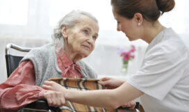 Nursing home Female nurse is taking care of the senior woman